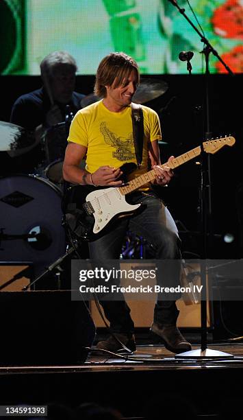 Musician Keith Urban performs onstage at the 44th Annual CMA Awards at the Bridgestone Arena on November 10, 2010 in Nashville, Tennessee.