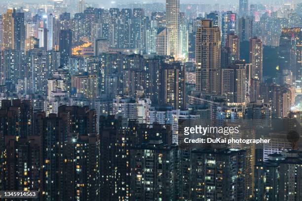 crowded residential district in china at night - chongqing stockfoto's en -beelden
