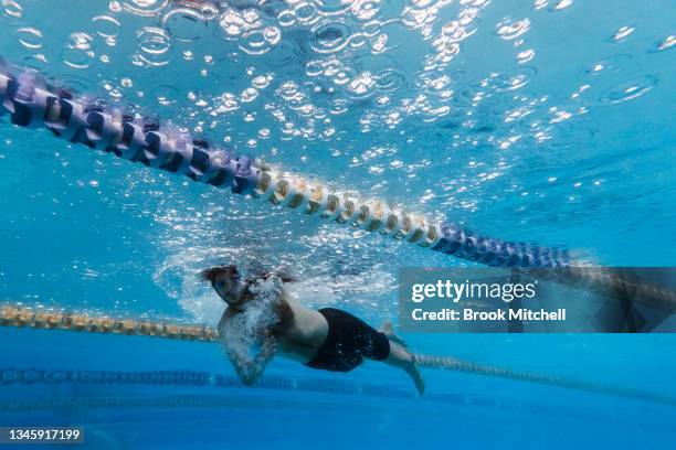 Swimmer cuts laps at the Annette Kellerman Aquatic Centre in Marrickville on October 11, 2021 in Sydney, Australia. COVID-19 restrictions have eased...