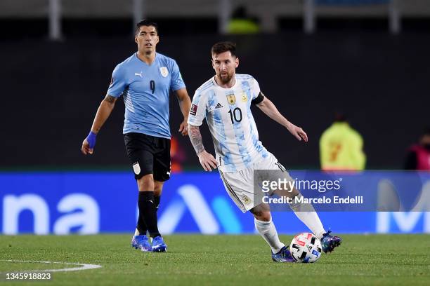 Lionel Messi of Argentina controls the ball against Luis Suarez of Uruguay during a match between Argentina and Uruguay as part of South American...