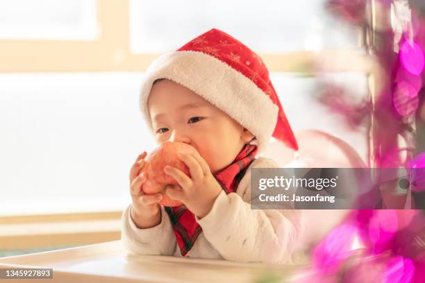 baby - apple chinese stock pictures, royalty-free photos & images