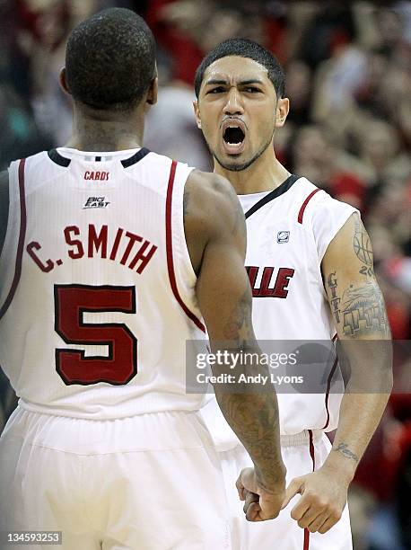 Peyton Siva of the Louisville Cardinals celebrates after hitting the winning shot in overtime to beat the Vanderbilt Commodores 62-60 in the game at...