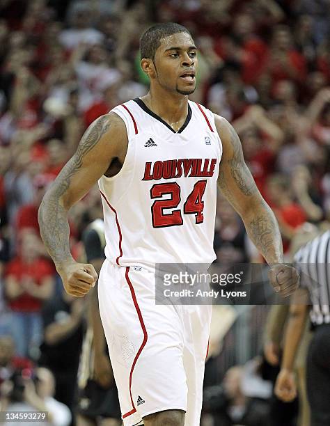 Chane Behanan of the Louisville Cardinals celebrates during the game the against Vanderbilt Commodores at KFC YUM! Center on December 2, 2011 in...