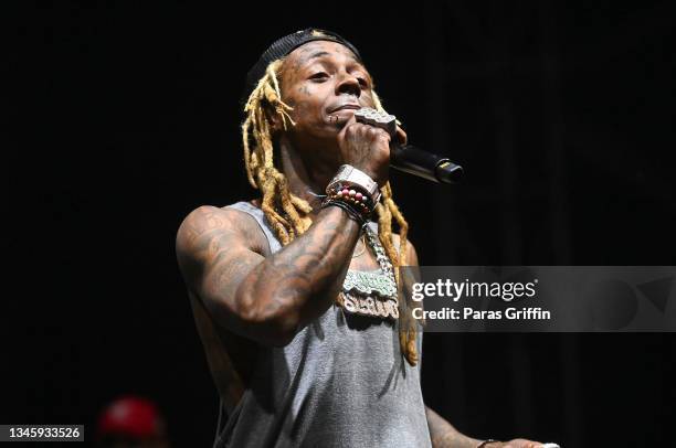 Rapper Lil Wayne performs onstage during day 2 of 2021 ONE Musicfest at Centennial Olympic Park on October 10, 2021 in Atlanta, Georgia.