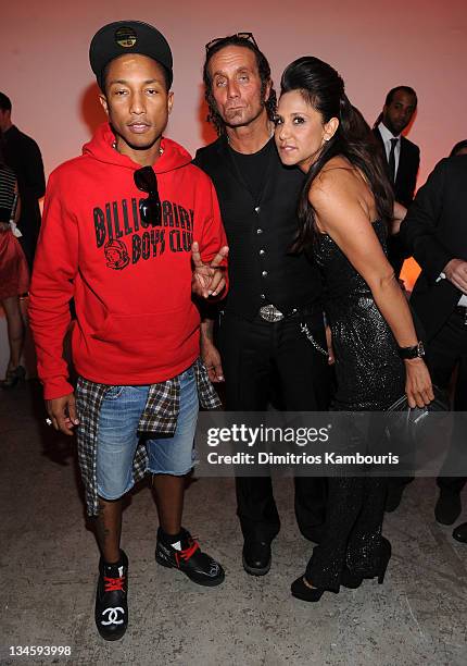 Pharrell Williams, Richard Stark and Laurie Lynn Stark attend the Designer of the Year Dinner hosted by Chrome Hearts + Design Miami at Art Basel at...