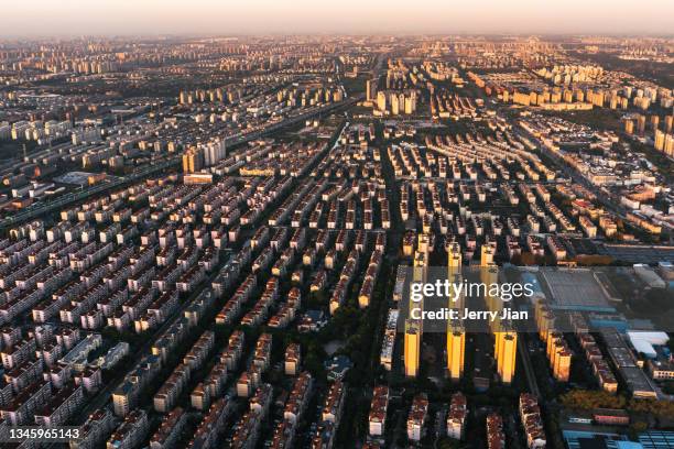 sunset and gold color buildings in shanghai - jian city stock pictures, royalty-free photos & images