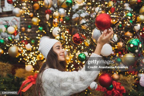 woman enjoying christmas holiday in christmas market. - christmas bbq stock pictures, royalty-free photos & images