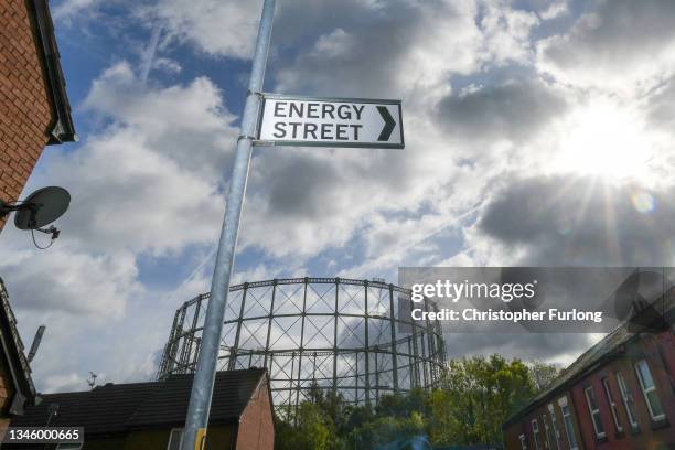 Disused gasometer stands behind a sign for Energy Street near homes on October 11, 2021 in Manchester, England. With the rise in wholesale gas costs,...