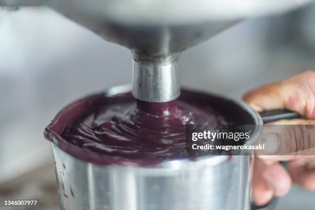 gross acai fresh pulp just extracted from an industrial mixer - fruit flesh stock pictures, royalty-free photos & images