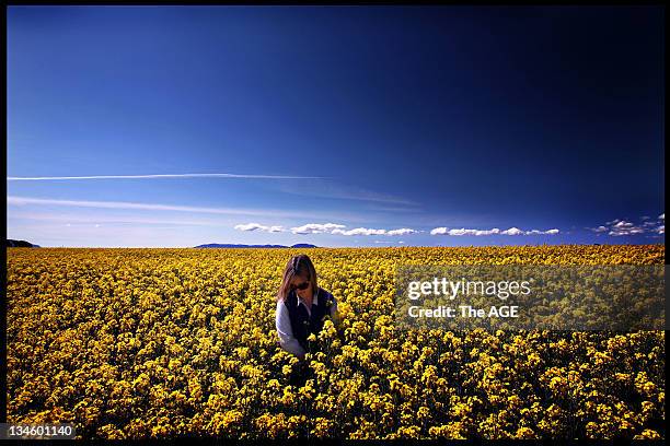 Cassie Franzose from Stockyard Hill looks across Canola fields to the hills in the background where a proposal has been announced to built wind...