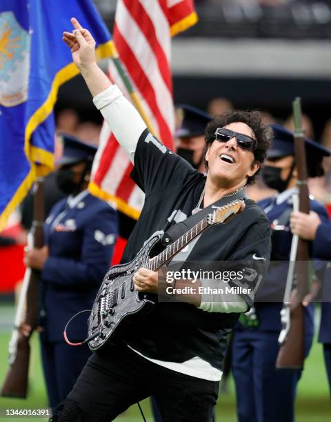 Recording artist Neal Schon of the band Journey performs the American national anthem before a game between the Chicago Bears and the Las Vegas...