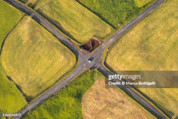 crossroad among farm fields, azores islands, portugal - crossroad top view stock-fotos und bilder