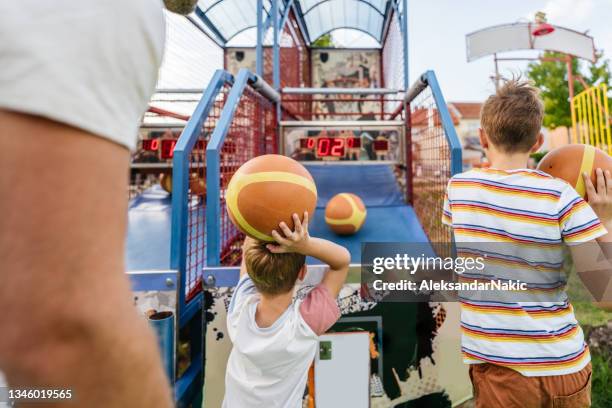 shooting hoops at the traveling fair - fair game bildbanksfoton och bilder