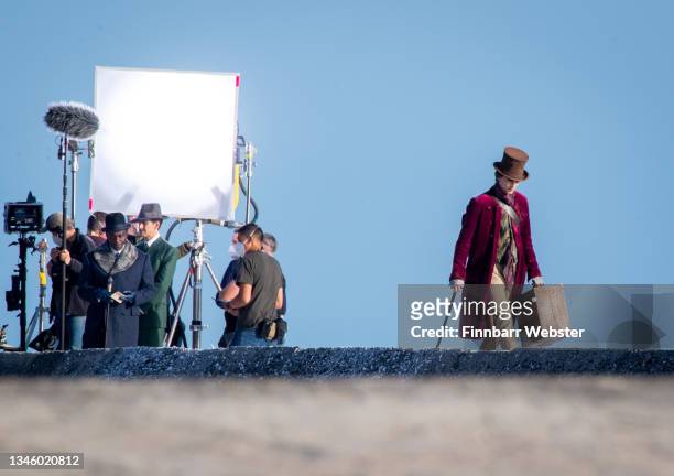Timothée Chalamet is seen as Willy Wonka during filming for the Warner Bros and the Roald Dahl Story Company's upcoming movie 'Wonka' on October 11...