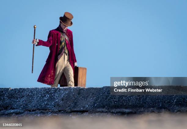 Timothée Chalamet is seen as Willy Wonka during filming for the Warner Bros and the Roald Dahl Story Company's upcoming movie 'Wonka' on October 11...