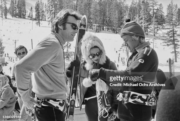 American actress Natalie Wood with her husband Richard Gregson and actor Clint Eastwood at a Benson & Hedges celebrity ski race in Bear Valley,...