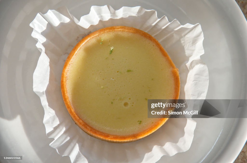 Lime tart in a pattypan on a plate
