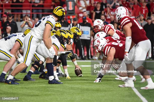 The Michigan Wolverines prepares to snap against the Nebraska Cornhuskers in the second half at Memorial Stadium on October 9, 2021 in Lincoln,...