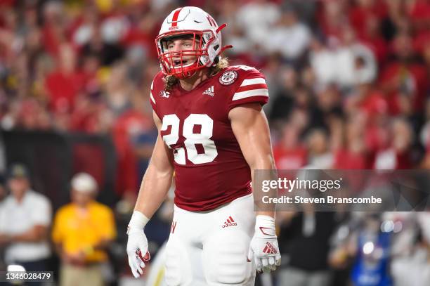 Linebacker Luke Reimer of the Nebraska Cornhuskers looks over the line against the Michigan Wolverines in the first half at Memorial Stadium on...