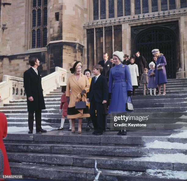 Queen Elizabeth the Queen Mother with Prince Charles, Princess Anne, Prince Andrew and other members of the royal family during a Christmas morning...