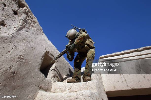 The Australian and Afghan National Army search a village at Musazai in the Uruzgan Province in Afghanistan. Pictured is Sergeant Adam McNamee during...