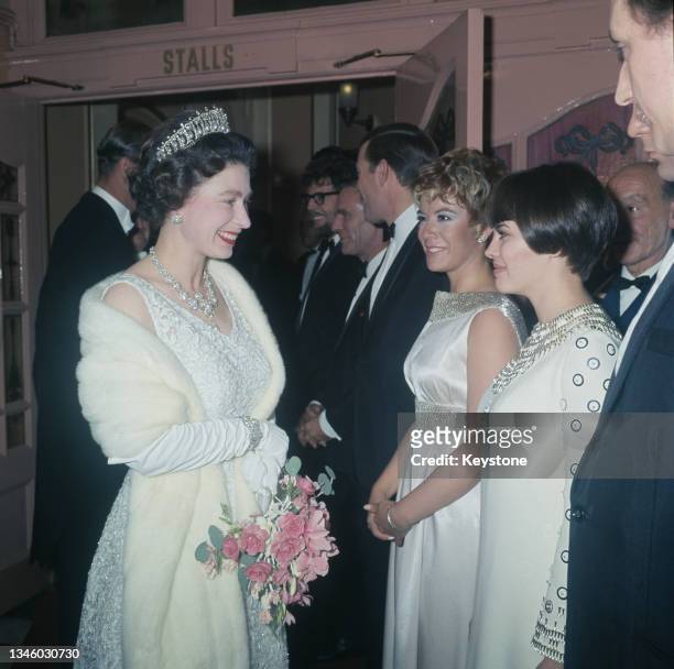 Queen Elizabeth II meets American singer Vikki Carr and French singer Mireille Mathieu at the Royal Variety Performance in London, 13th November...