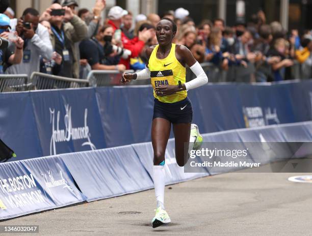 Edna Kiplagat of Kenya crosses the finish line for second place during the 125th Boston Marathon on October 11, 2021 in Boston, Massachusetts.