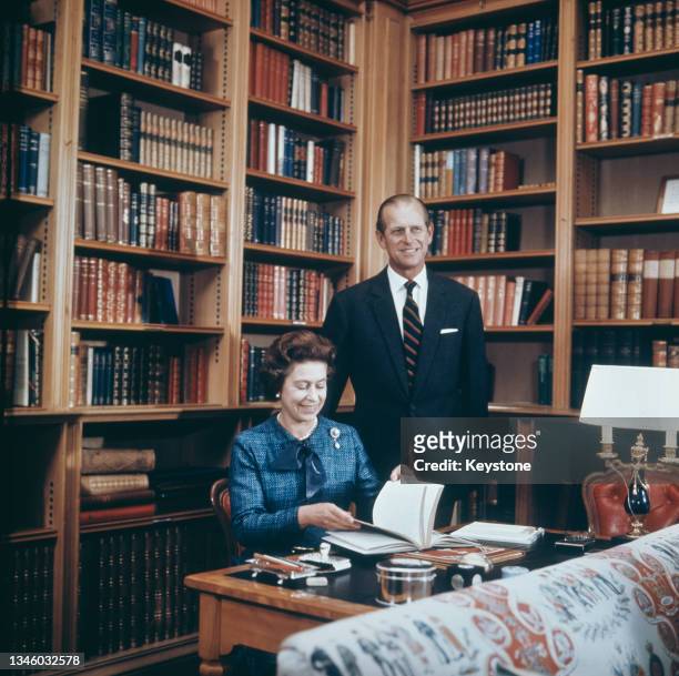 Queen Elizabeth and Prince Philip, the Duke of Edinburgh in the study at Balmoral Castle, Scotland, 26th September 1976.