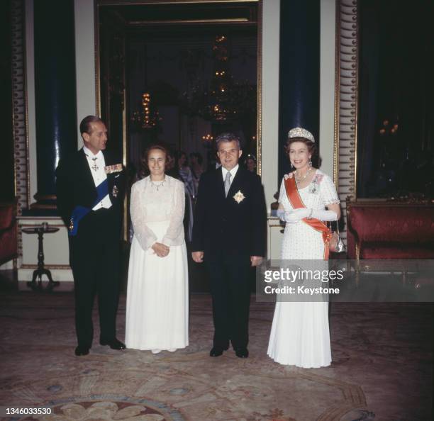 Queen Elizabeth II and Prince Philip, the Duke of Edinburgh pose with Romanian Communist leader Nicolae Ceausescu and his wife Elena Ceausescu at...