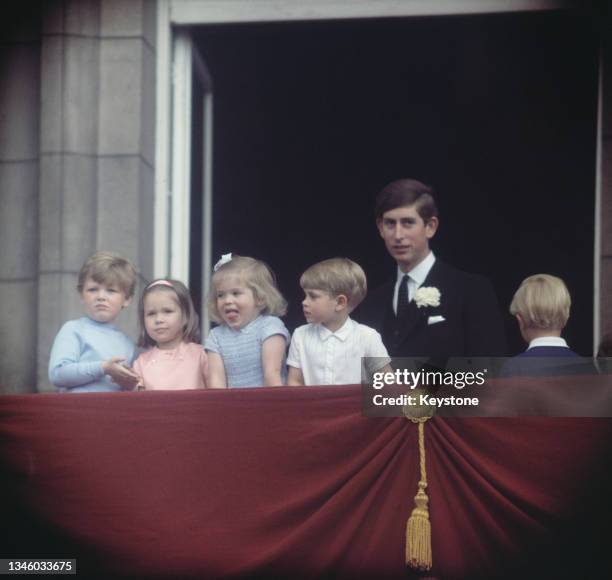 Prince Charles on the balcony of Buckingham Palace in London with a group of royal children, UK, circa 1966. From left to right, the children are...