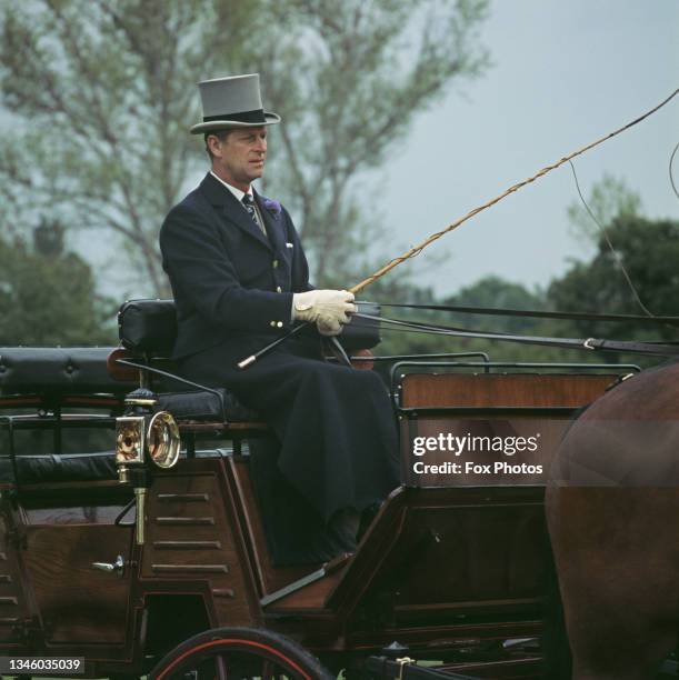 Prince Philip, Duke of Edinburgh driving a carriage, UK, circa 1970.