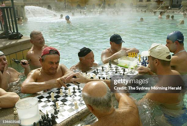 Bathers play chess at the iconic Szechenyi Bath in Budapest, Hungary.