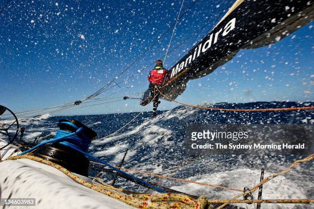 Rolex Sydney to Hobart Yacht Race, Crewman Dean Curtis works on the boom with 30-knot winds coming off the east coast of Tasmania on Lahana during...
