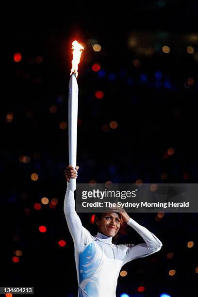 Australian athlete Cathy Freeman about to light the Olympic cauldron at the opening ceremony of the Sydney 2000 Olympic games at Stadium Australia,...