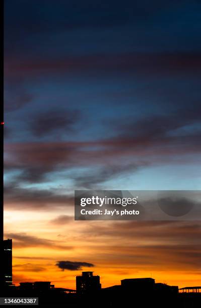 dramatic sunset cloudscape with multiple layers clouds. - daylight savings stock pictures, royalty-free photos & images