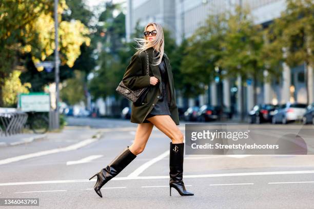 October 11: Influencer Saraja Roberta Elez, wearing a dark green vintage blazer, a black leather blouse by Frame, black shorts by Prada, a black bag...