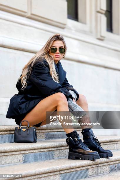 October 11: Influencer Saraja Roberta Elez, wearing a black jacket by Prada, a grey pullover by Saraja Roberta Elez, black shorts by Prada, a black...