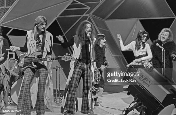 English glam rock band Wizzard perform on British music chart show 'Top of the Pops', UK, 22nd May 1973. Bassist Rick Price is on the left, with lead...