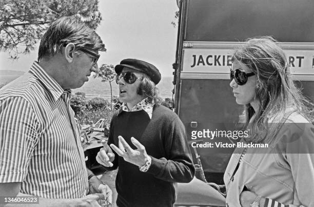Team founder Ken Tyrrell with Scottish racing driver Jackie Stewart and wife Helen during practice for the Monaco Grand Prix, 1st June 1973.