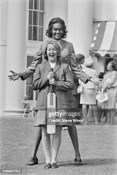 English cricketer Rachael Heyhoe Flint , captain of the England women's cricket team, poses with Jamaican cricketer Paulette Lynch of the...