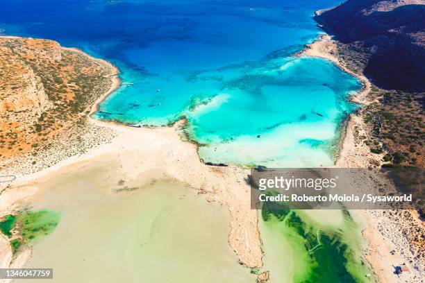 balos lagoon by the crystal sea, crete, greece - lagoon stock-fotos und bilder