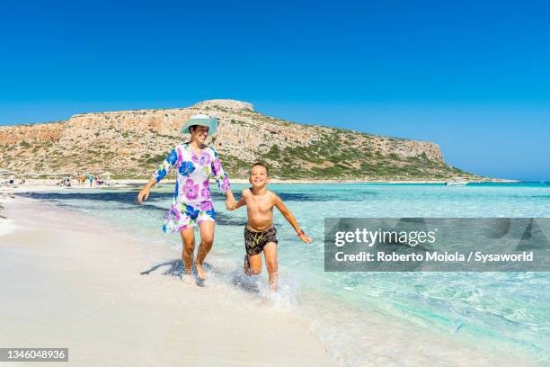 cheerful woman and son having fun at the sea, crete - creta fotografías e imágenes de stock