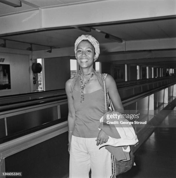 Jamaican filmmaker, photographer and actress Esther or Ester Anderson at Heathrow Airport in London, UK, 26th June 1973.