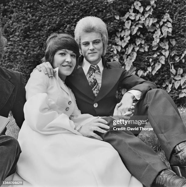 English rock drummer Mick 'Woody' Woodmansey of David Bowie's backing band the Spiders from Mars, marries June Harrison, UK, 7th July 1973. He was...