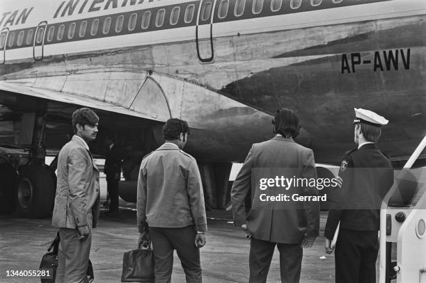 Group of Pakistani men being deported from Heathrow Airport in London, following the Pakistan Act which resulted from Pakistan's departure from the...