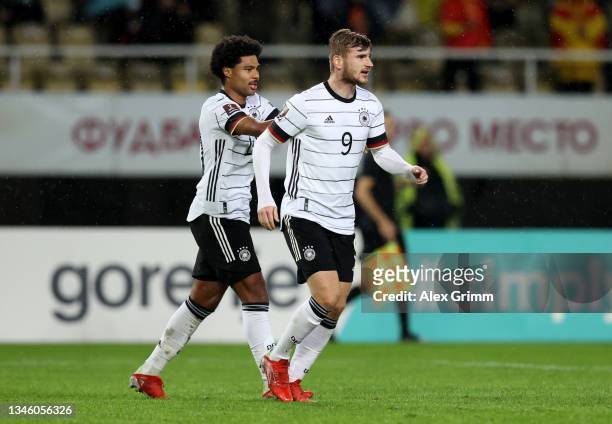 Timo Werner of Germany celebrates with Serge Gnabry after scoring their team's second goal during the 2022 FIFA World Cup Qualifier match between...