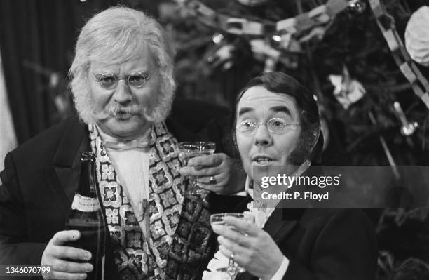 British comedians Ronnie Barker and Ronnie Corbett, aka the Two Ronnies, filming their Christmas show 'The Two Ronnies Old Fashioned Christmas...