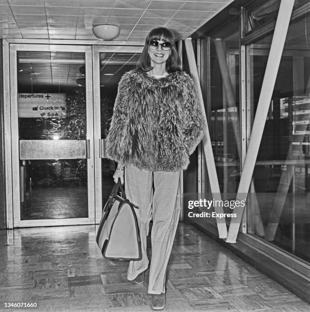 British model Paulene Stone at Heathrow Airport in London, UK, 27th January 1974. She is on her way to the United States.