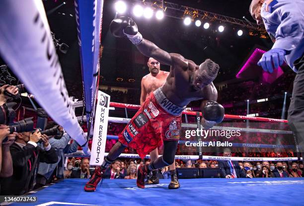 Deontay Wilder is knocked out by Tyson Fury in the 11th round during their WBC heavyweight title fight at T-Mobile Arena on October 09, 2021 in Las...