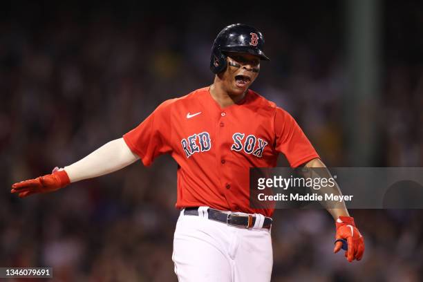 Rafael Devers of the Boston Red Sox celebrates his three-run homerun in the third inning against the Tampa Bay Rays during Game 4 of the American...